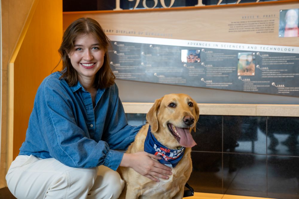 Marianna Spiotta and dog posing for a photo