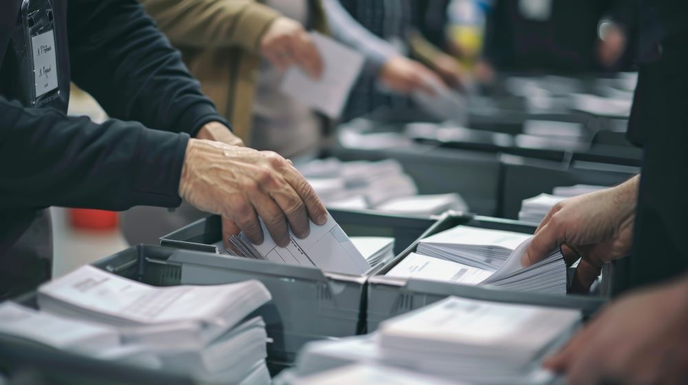 Poll workers sorting ballots