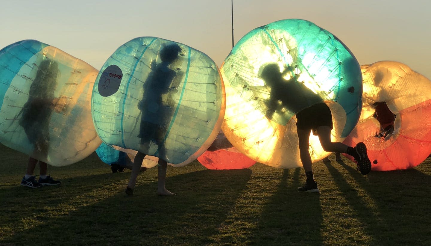 People in bubbles playing 