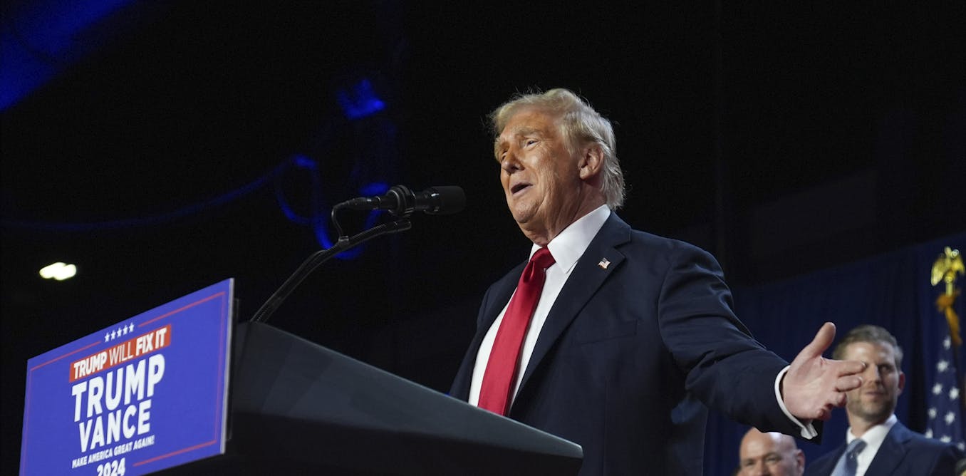 President Elect Donald Trump speaks at a podium