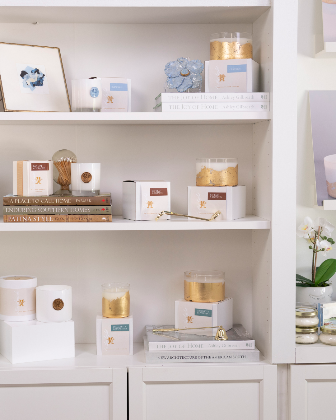 Melissa Warnke&#x27;s candles displayed on a shelf.