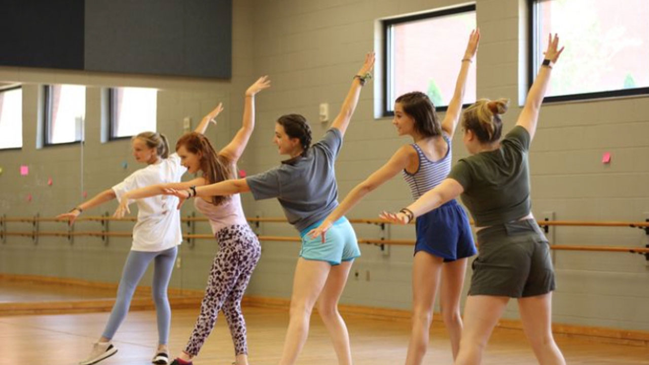 Five students dancing in the musical theatre summer camp