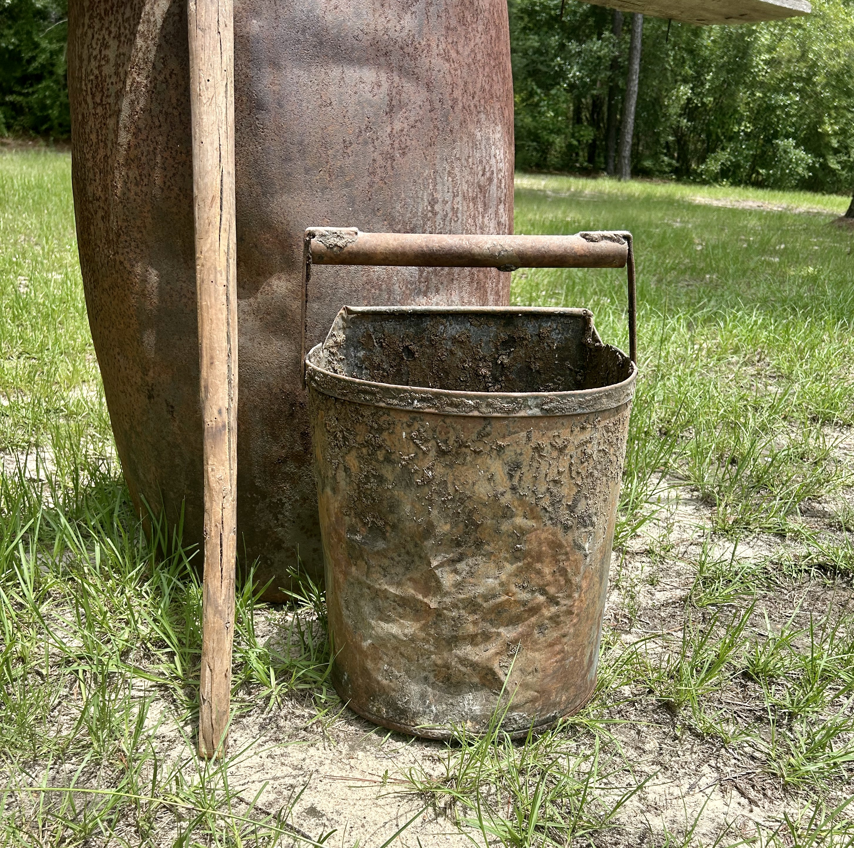 Different size buckets were used to collect turpentine from forests in Alabama before they were transferred to distilleries.