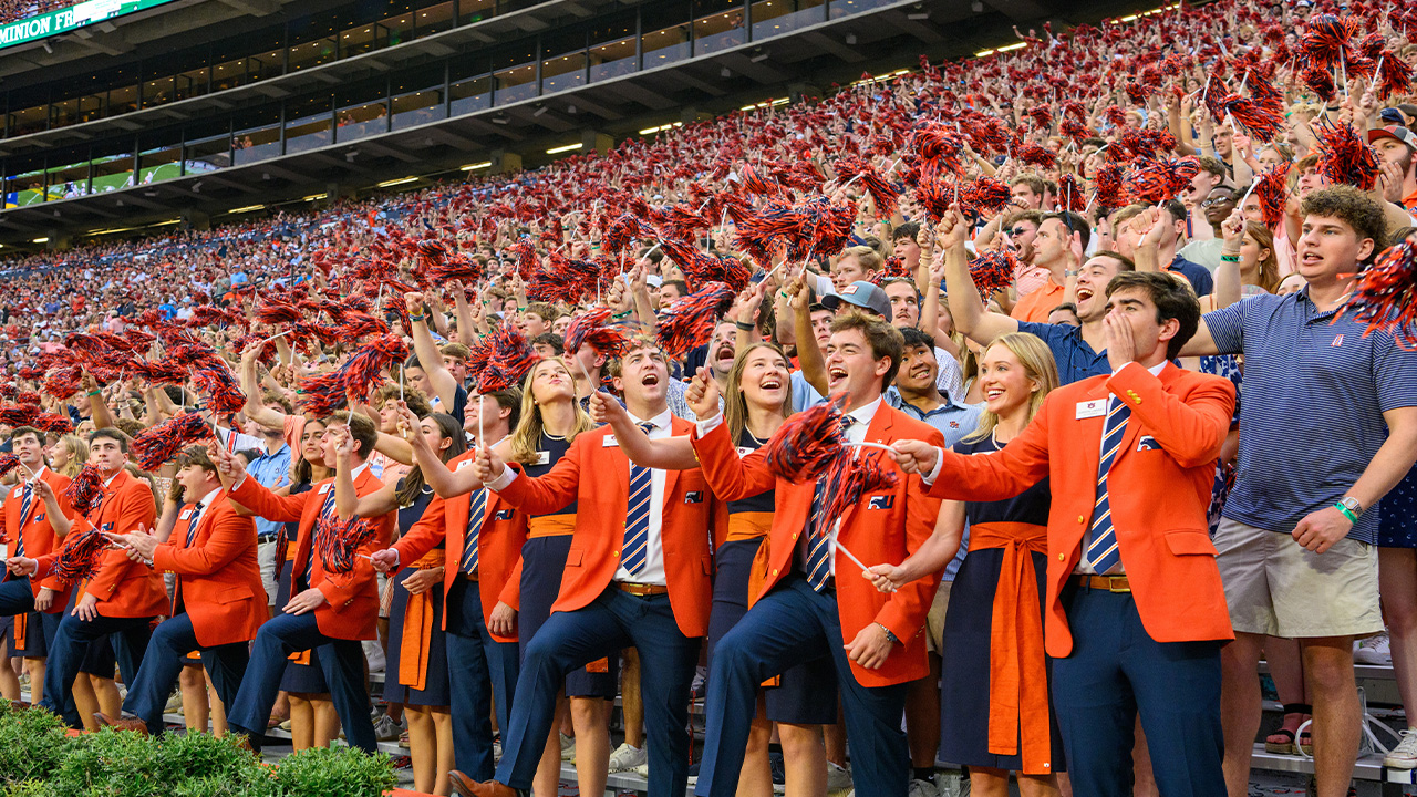 Fans cheer and wave shakers in the stands of Jordan-Hare Stadium
