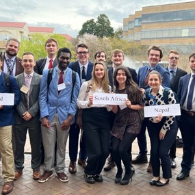 Group of students standing in front of a building