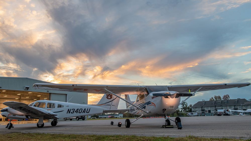 Auburn planes outside of a hangar