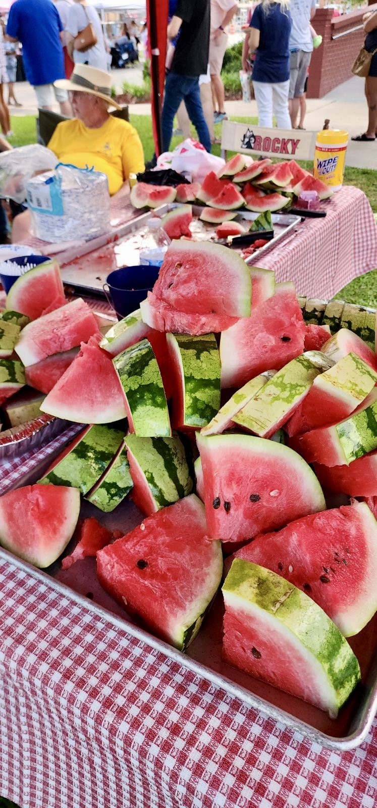 Crowds enjoy watermelon given out by the Masonic Lodge at the Let Freedom Ring celebration.