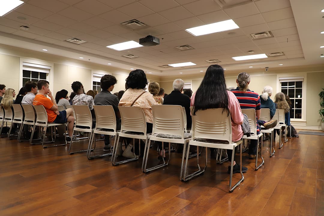 A room full of event guests at the center
