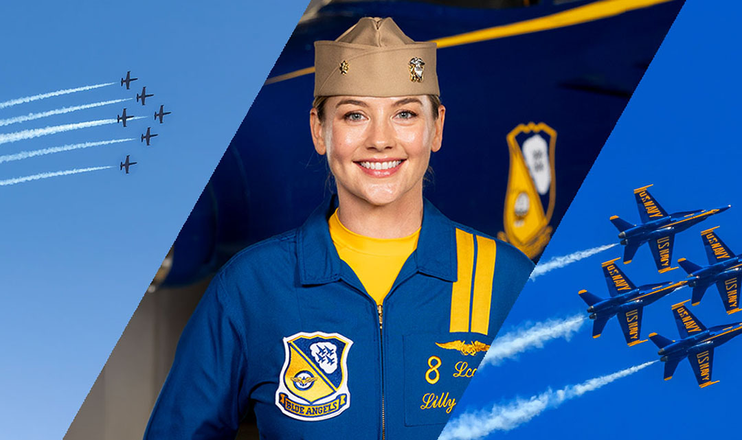 Lieutenant Commander Lilly Montana stands at attention in front of plane