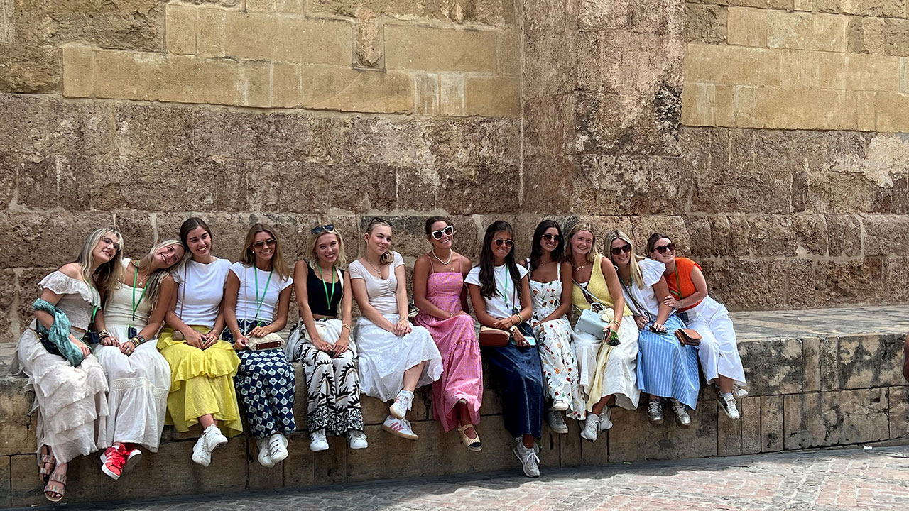 Public relations students posing for a group photo in Seville, Spain