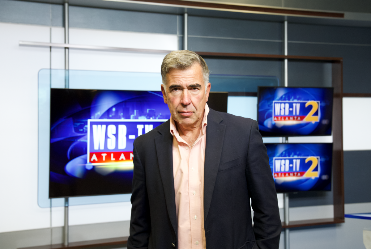 Mark Winne stands in front of WSB-TV monitors