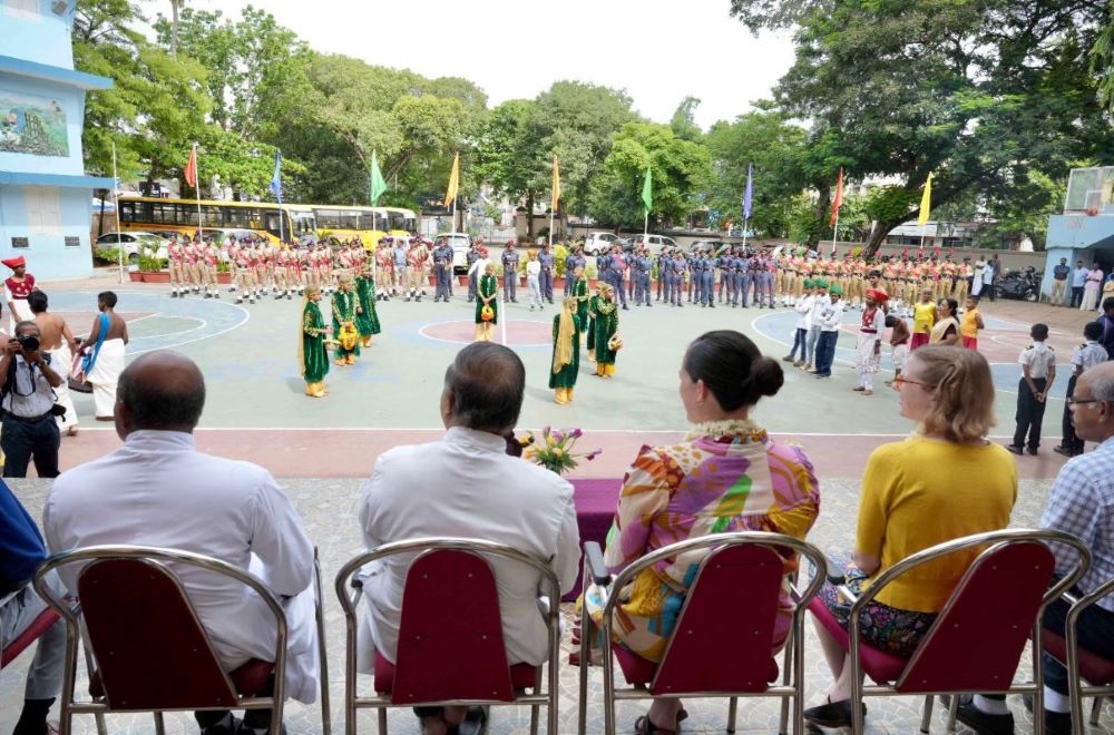 Laura West Ramkorun watching a student assembly at St. Joseph's School