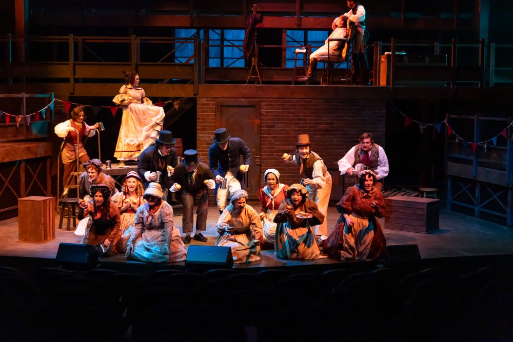 Actors in Victorian era clothing perform a number in Sweeney Todd