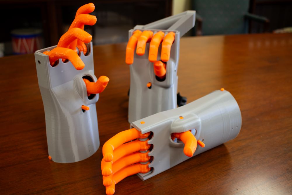 Three 3-D printed models of the Kassel Hand, a 16th-century prosthetic hand