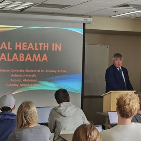Dr. Tommy Johnson presenting a lecture to students
