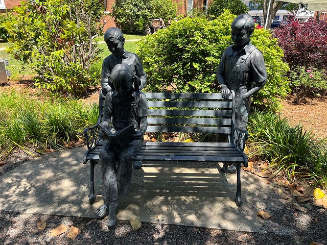 An iron statue showing Scout and Jem Finch with friend Dill Harris commemorates the legacy of Harper Lee's "To Kill A Mockingbird" outside the Monroe County Courthouse in Monroeville, Alabama.