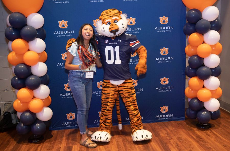 Girl standing next to Aubie