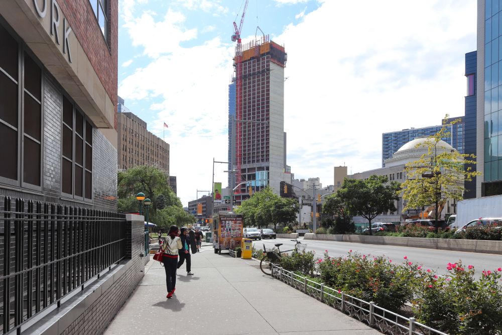 Tall building under construction on Fulton Street in New York