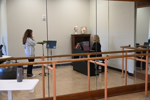 A student taking a lesson with Professor of Practice Charlotte Lee