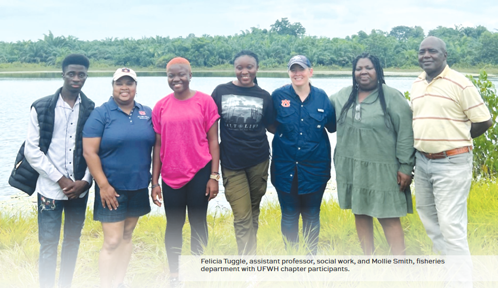 Felicia Tuggle standing with group of people