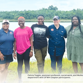 Felicia Tuggle standing with group of people