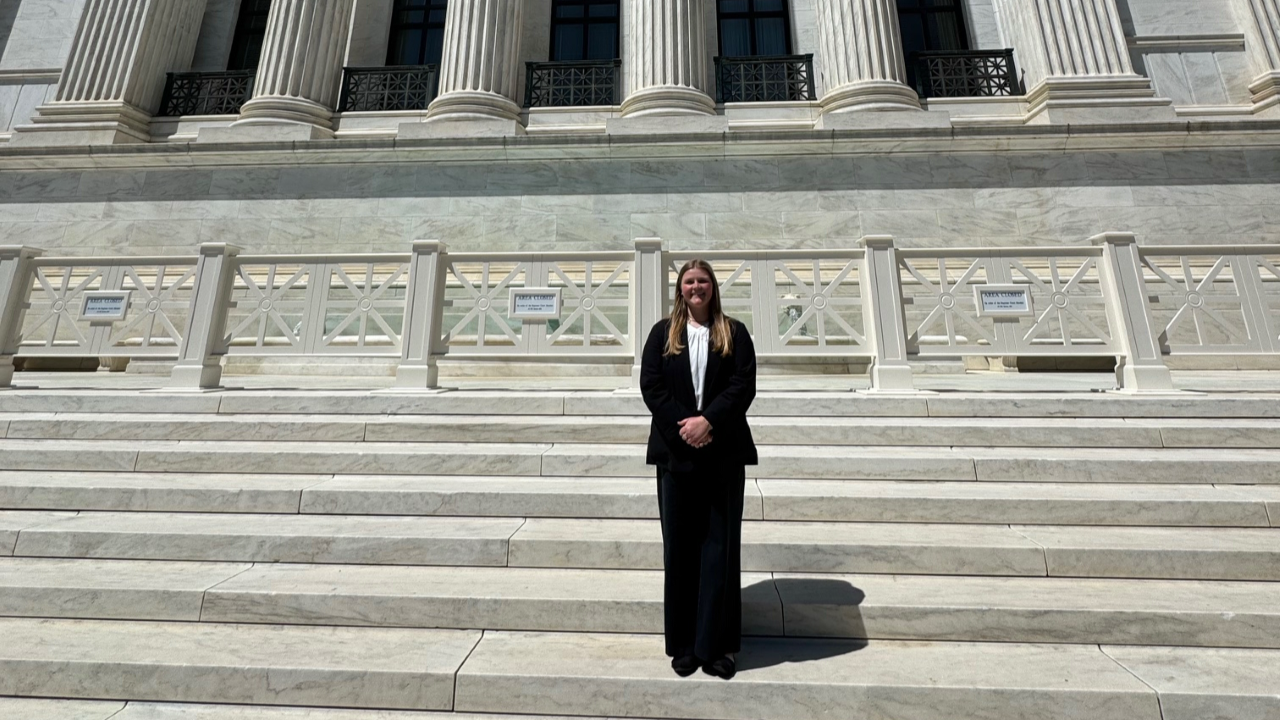 Lilli Wellbaum standing on the steps of the U.S. Supreme Court building