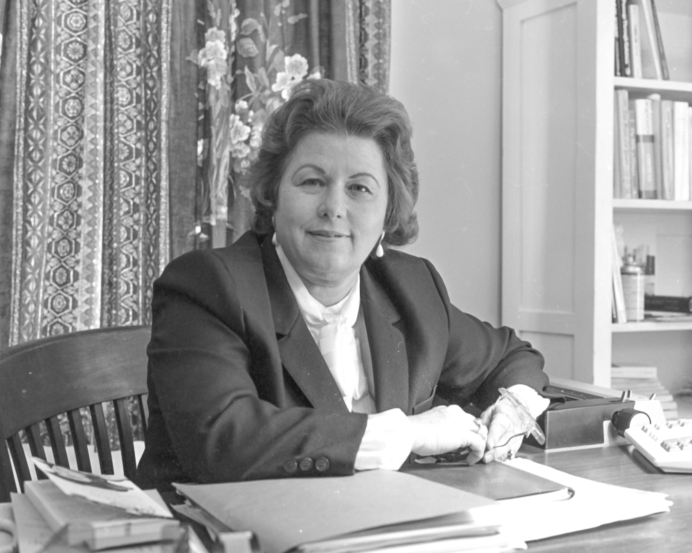 Leah Rawls Atkins circa 1985 sitting at director's desk in Pebble Hill