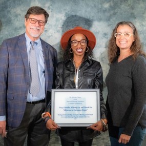 Whitney Lee with award