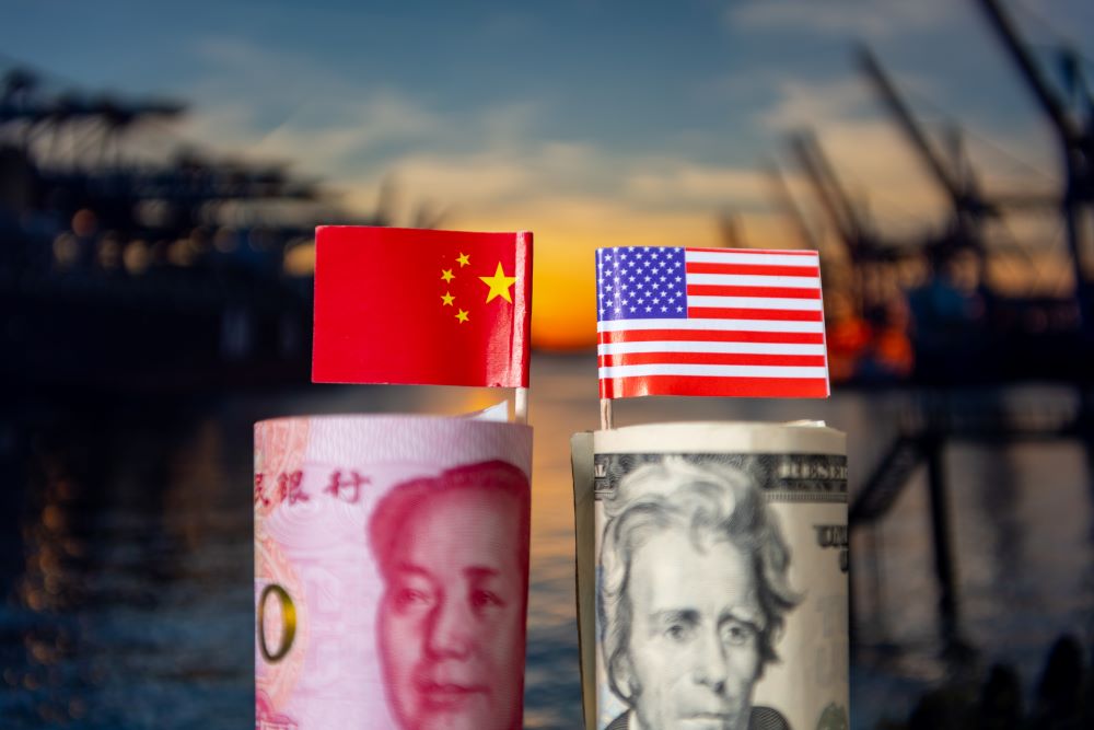 Chinese flag and money beside US flag and money