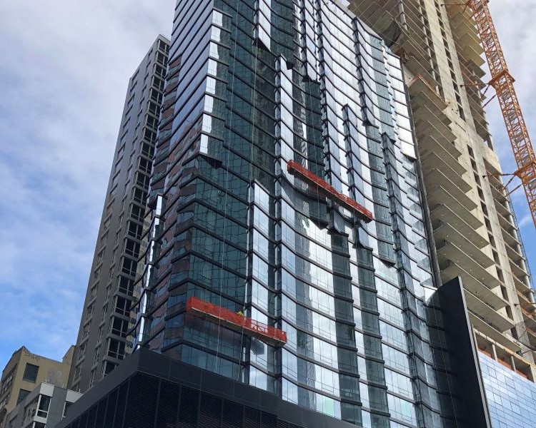 Close up of the mirrored side of a building in New York City
