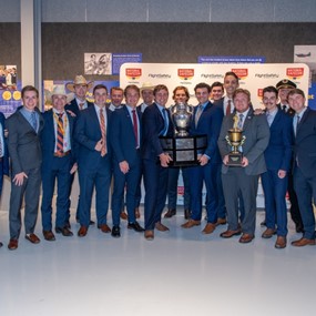 War Eagle Flying Team members stand with Loening trophy