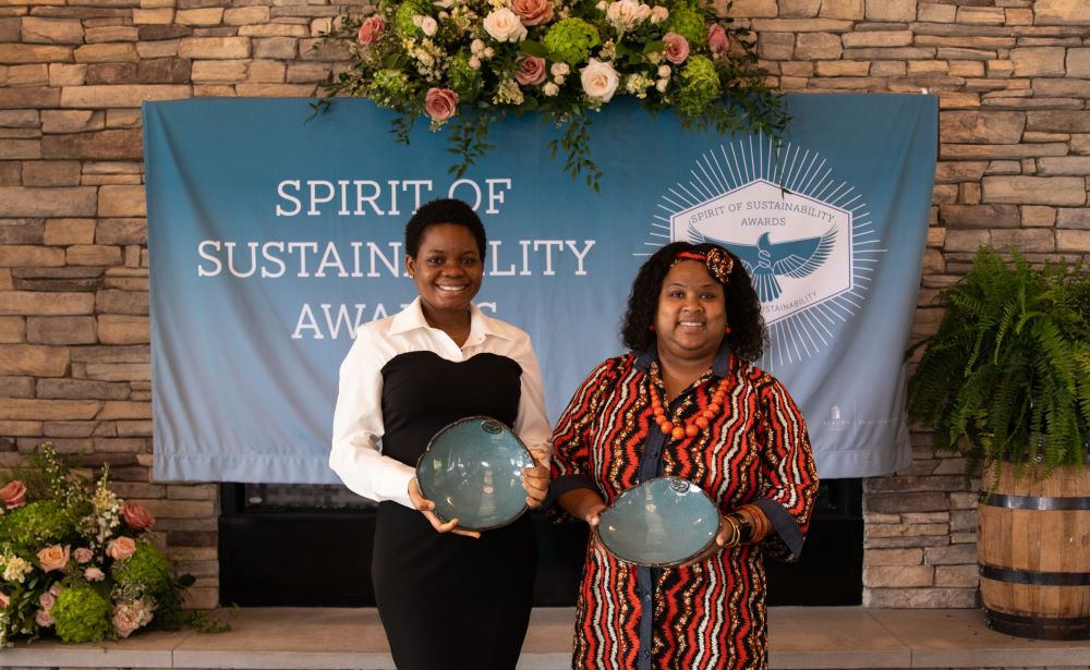 Abosede Onifade and Dr. Felicia Tuggle accepting Spirit of Sustainability Awards