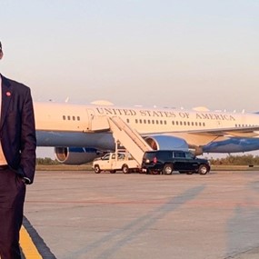 Cody Sanders standing in front of Air Force One