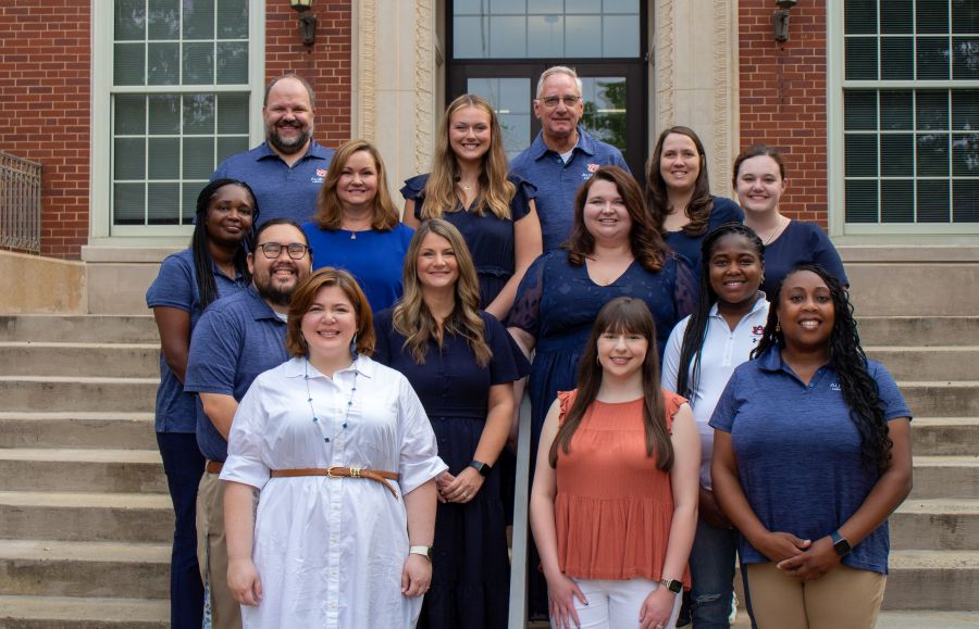 Student advising team in front of Tichenor Hall
