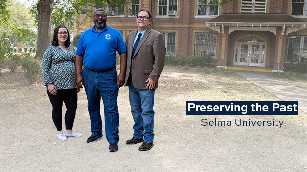 Graduate student Laura King, Selma University President Stanford Angion and Southern History Professor Keith Hebert outside Dinkins Memorial Hall