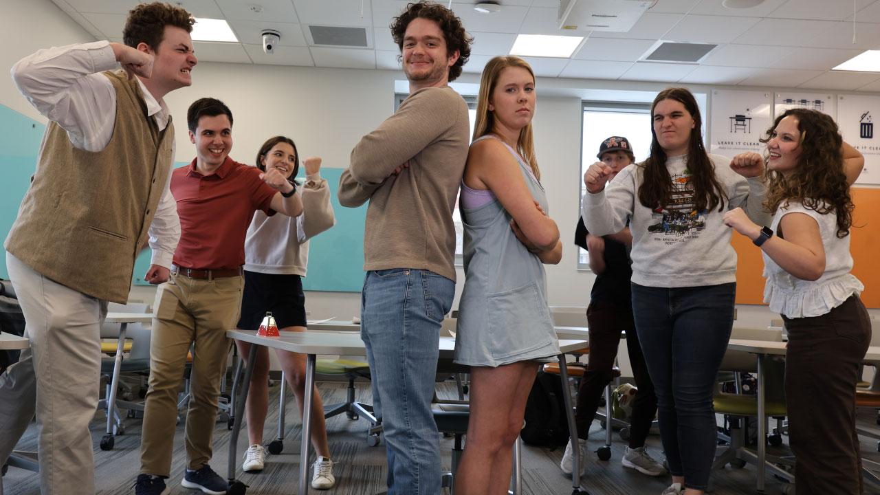 Students in Craig's world history class reenacting a historical argument, with both sides angry at the other