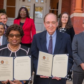 Tuskegee and Auburn representatives standing in front of Samford Hall 