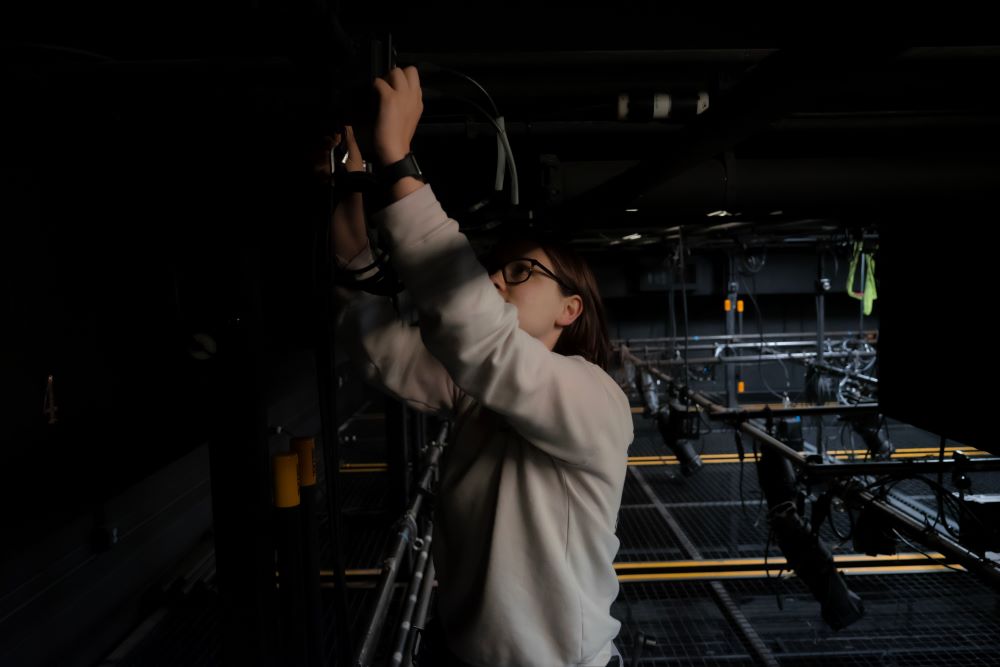 Katie Wolfe working backstage at the theater