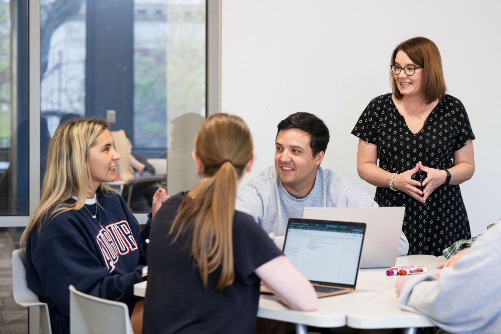 Kelly Kennington leading class discussion in a history course