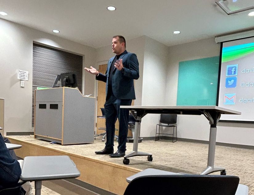 Garlock standing on a stage