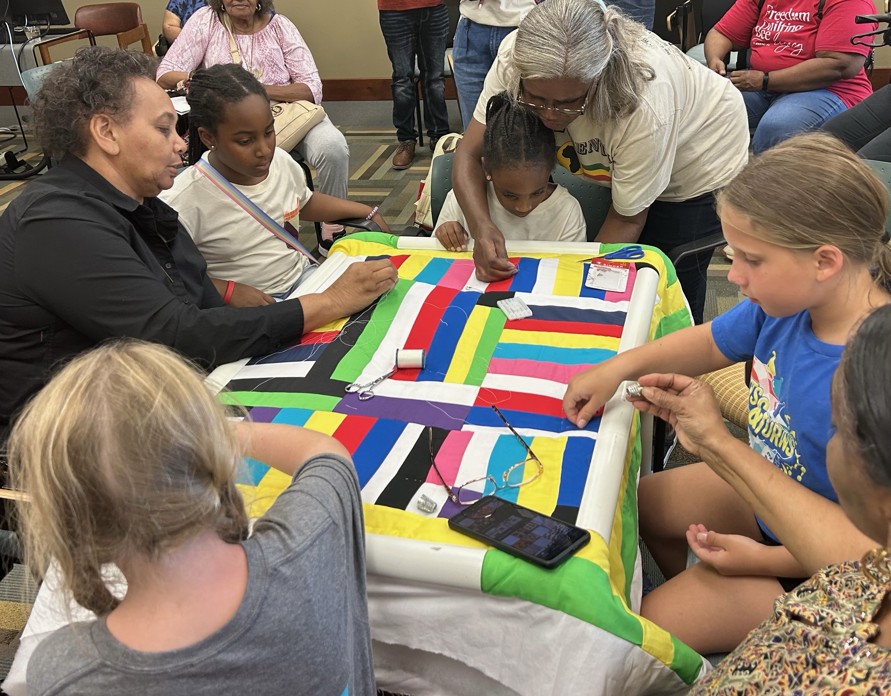 Gees Bend Freedom Quilters show young artists the art of quilting at the Colvin-Feagin Art Show at Alabama State University.