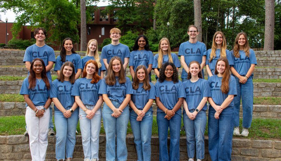 Group of students standing in two rows and posing for a photo