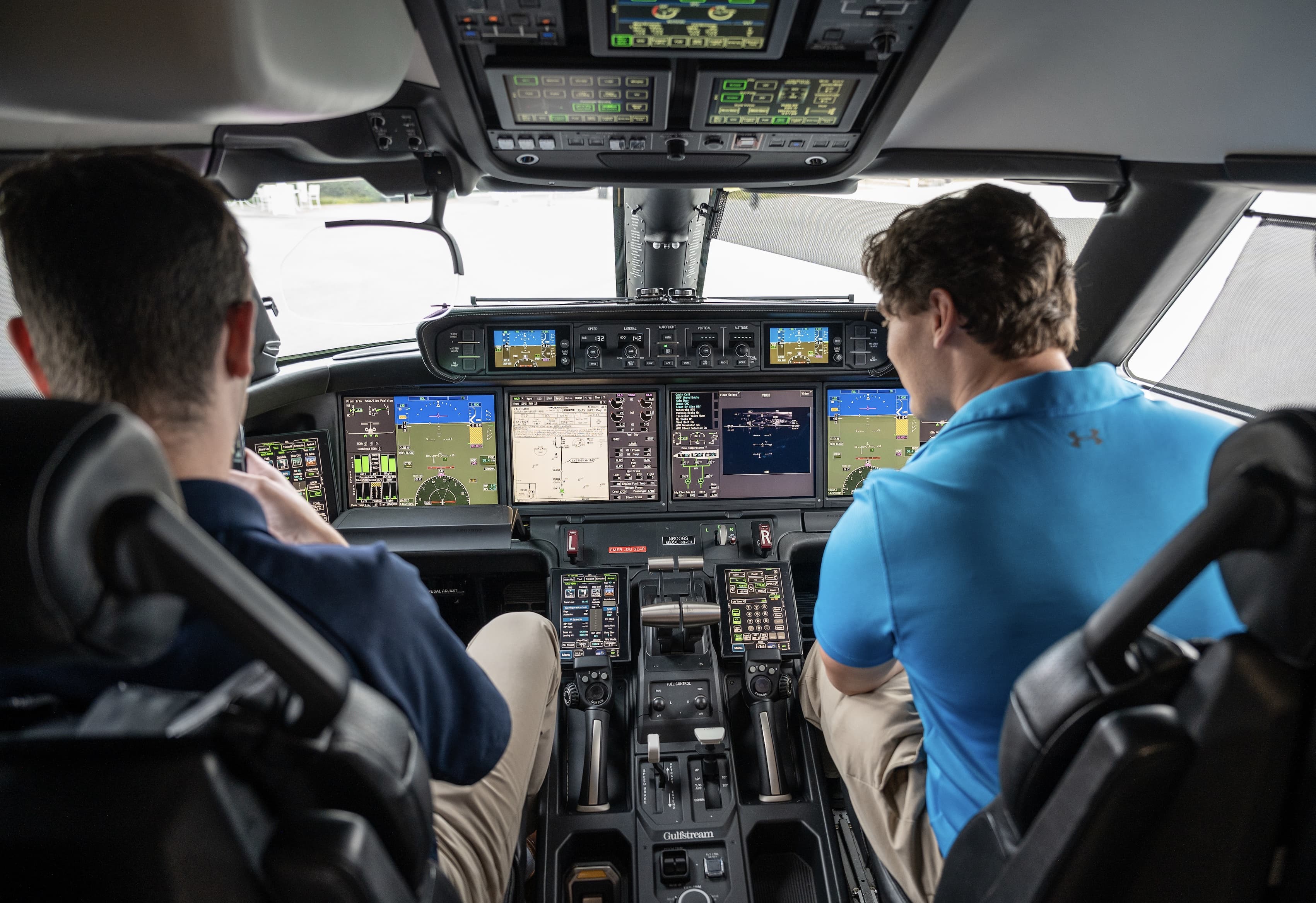 Student working on the wing of a plane