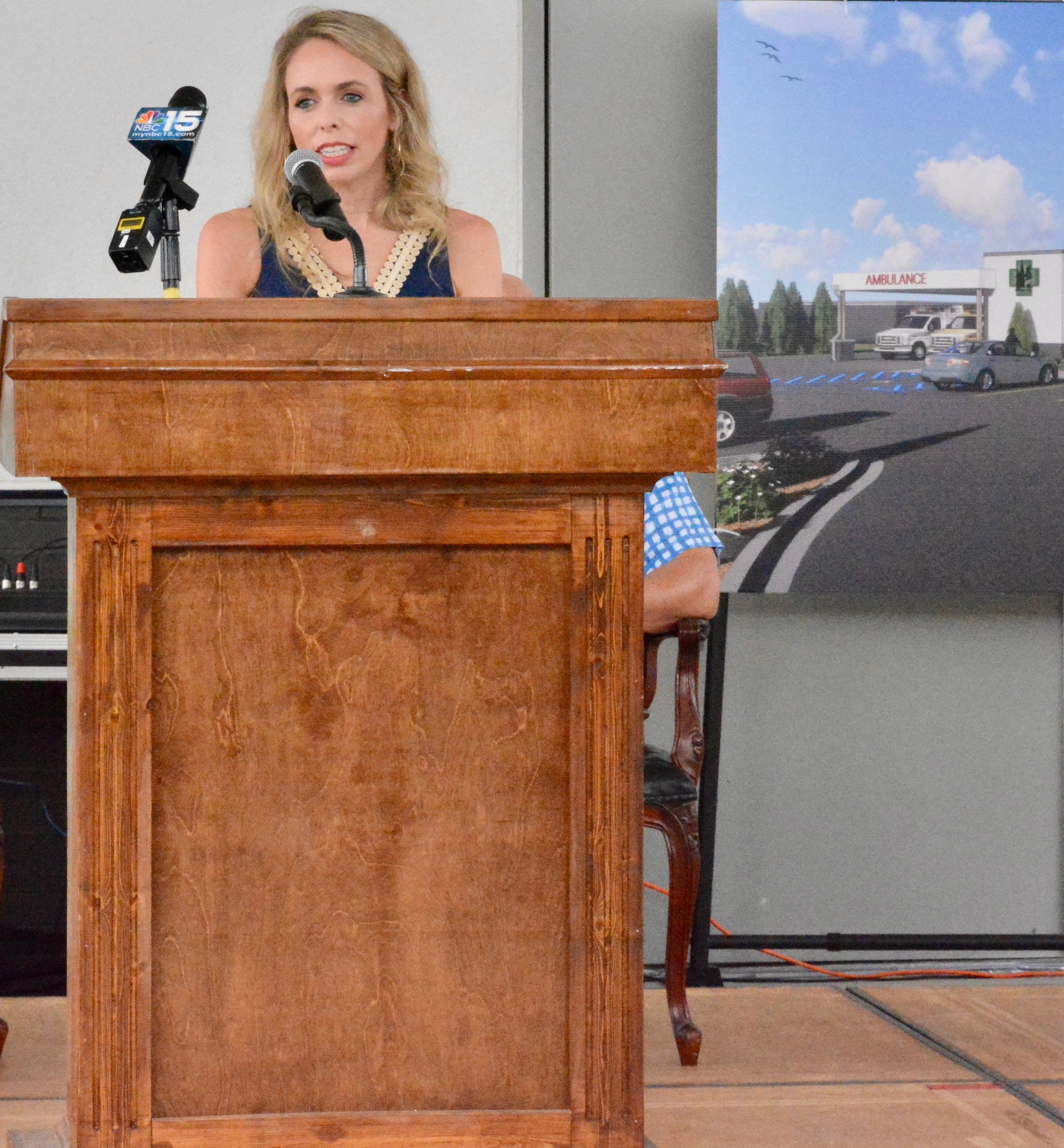 woman speaking at podium