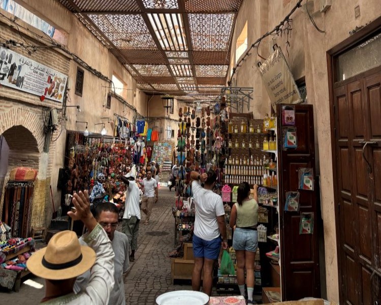 People shopping in a colorful marketplace
