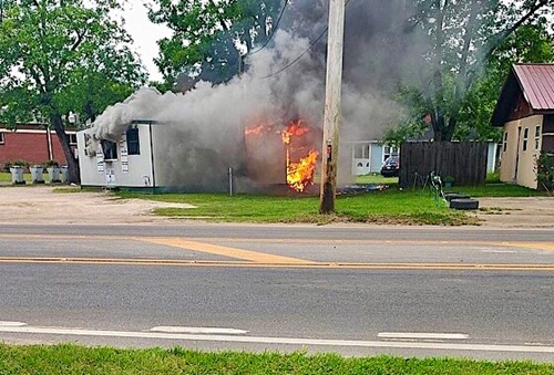 Flames and smoke billow from JJ's BBQ