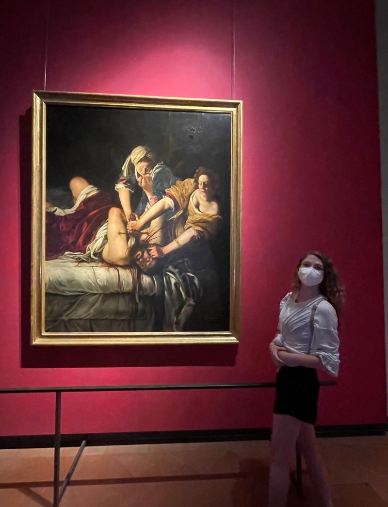 Sarah Walker standing in front of baroque painting