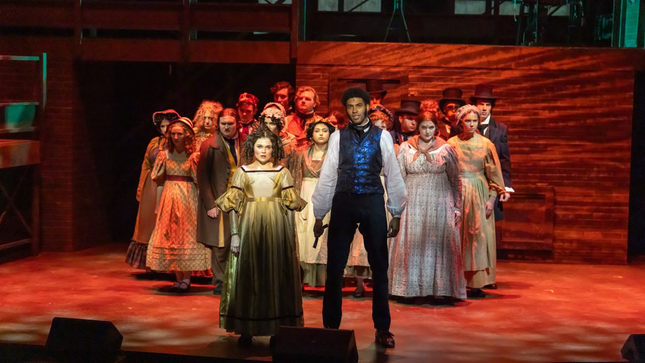 The cast of Sweeney Todd performing onstage during dress rehearsal