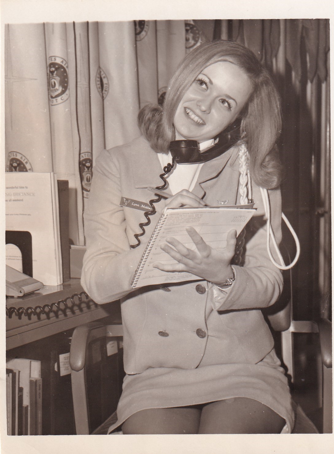 A young Linda Lee answering the phone for Angel Flight