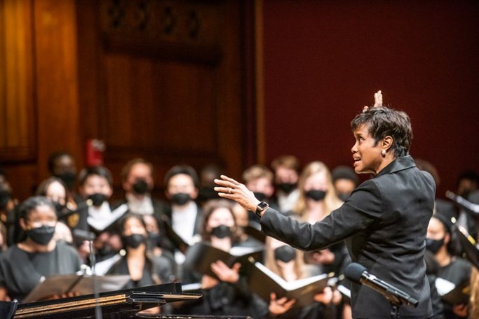 Rosephanye Powell conducting choir on stage